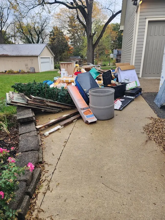 Dumpster being loaded with debris for Demolition Dumpster Rental in Spring Ridge
